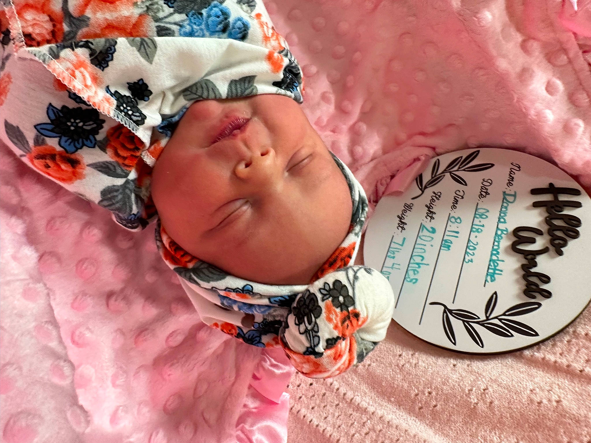 Donna is registered to the contest to win money with this photo: baby, baby_products, baby_sleeping, baby_toddler_clothing, child, comfort, fashion_accessory, flesh, happy, headwear, human, jewellery, linens, magenta, pattern, person, pink, toddler