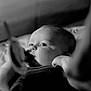 Octavia participe au concours pour gagner de l'argent avec cette photo : baby, infant, black_and_white, portrait, close_up, face, eyes, hand, soft_focus, curious, newborn, child, monochrome, cute, young, indoors, expression, skin, person, baby_clothing