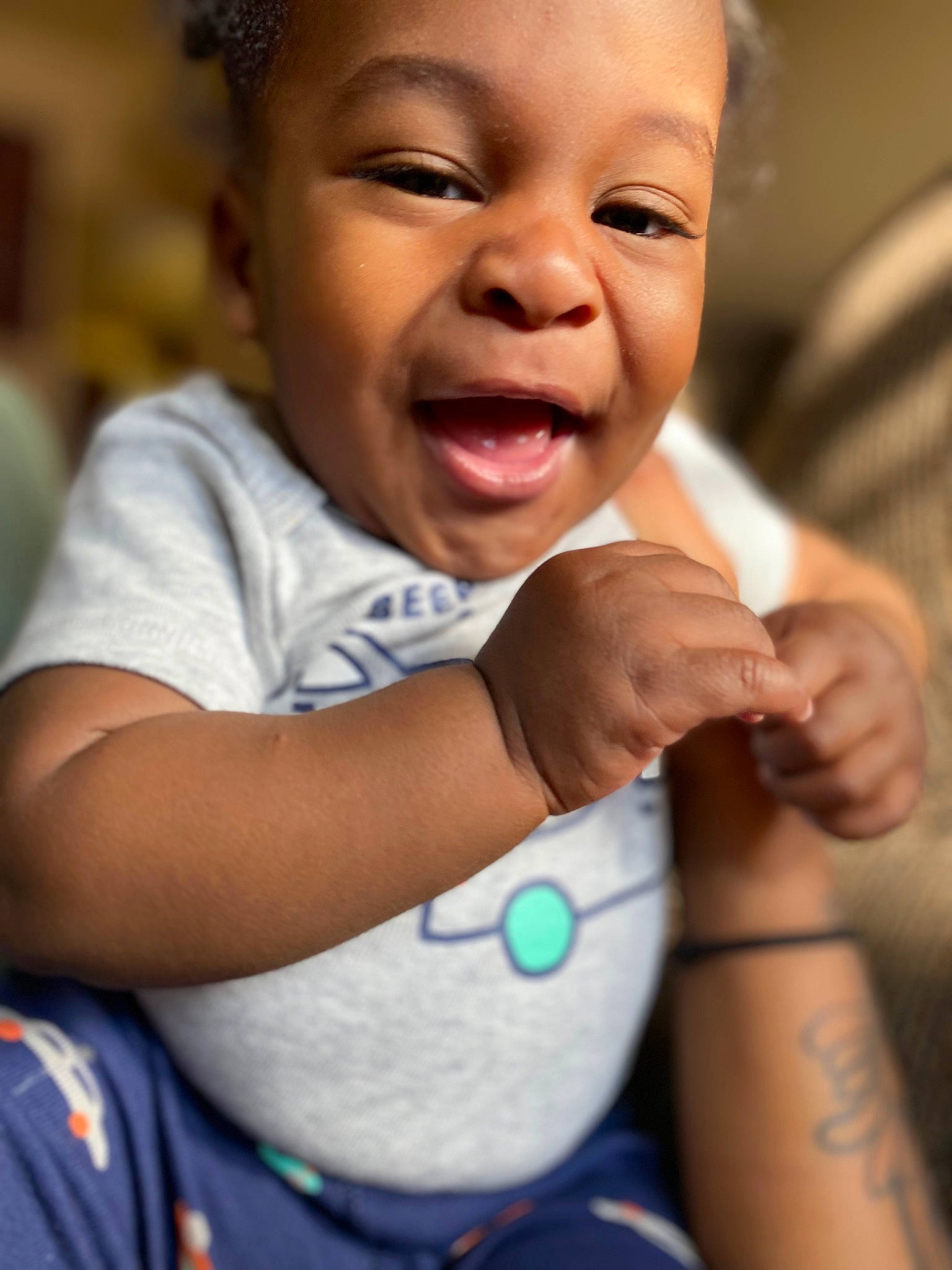 Sabastian joined the competition — help win amazing prizes! arm, baby, baby_toddler_clothing, cheek, eye, face, facial_expression, finger, gesture, hand, happy, human, iris, lip, nose, organ, person, skin, sleeve, smile