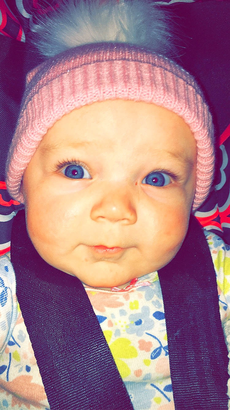 Iyanna joined the competition — help win amazing prizes! baby_toddler_clothing, beanie, cheek, child, chin, collar, eye, eyebrow, forehead, headgear, headwear, iris, knit_cap, lip, magenta, nose, organ, person, skin, textile