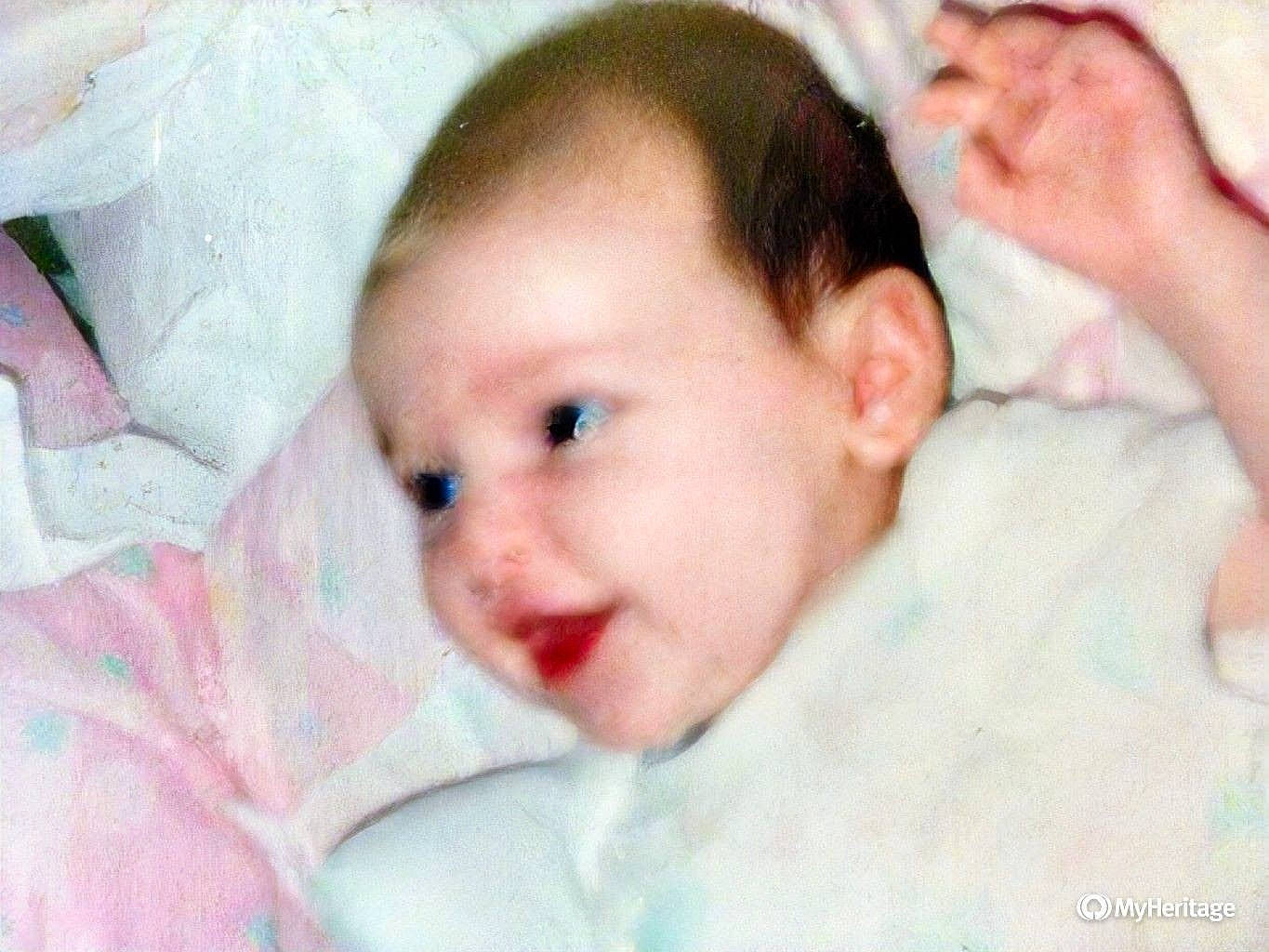 B B is registered to the contest to win money with this photo: baby, baby_toddler_clothing, cheek, chin, comfort, ear, eye, eyebrow, eyelash, face, finger, gesture, happy, iris, lip, mouth, nose, person, skin, toddler