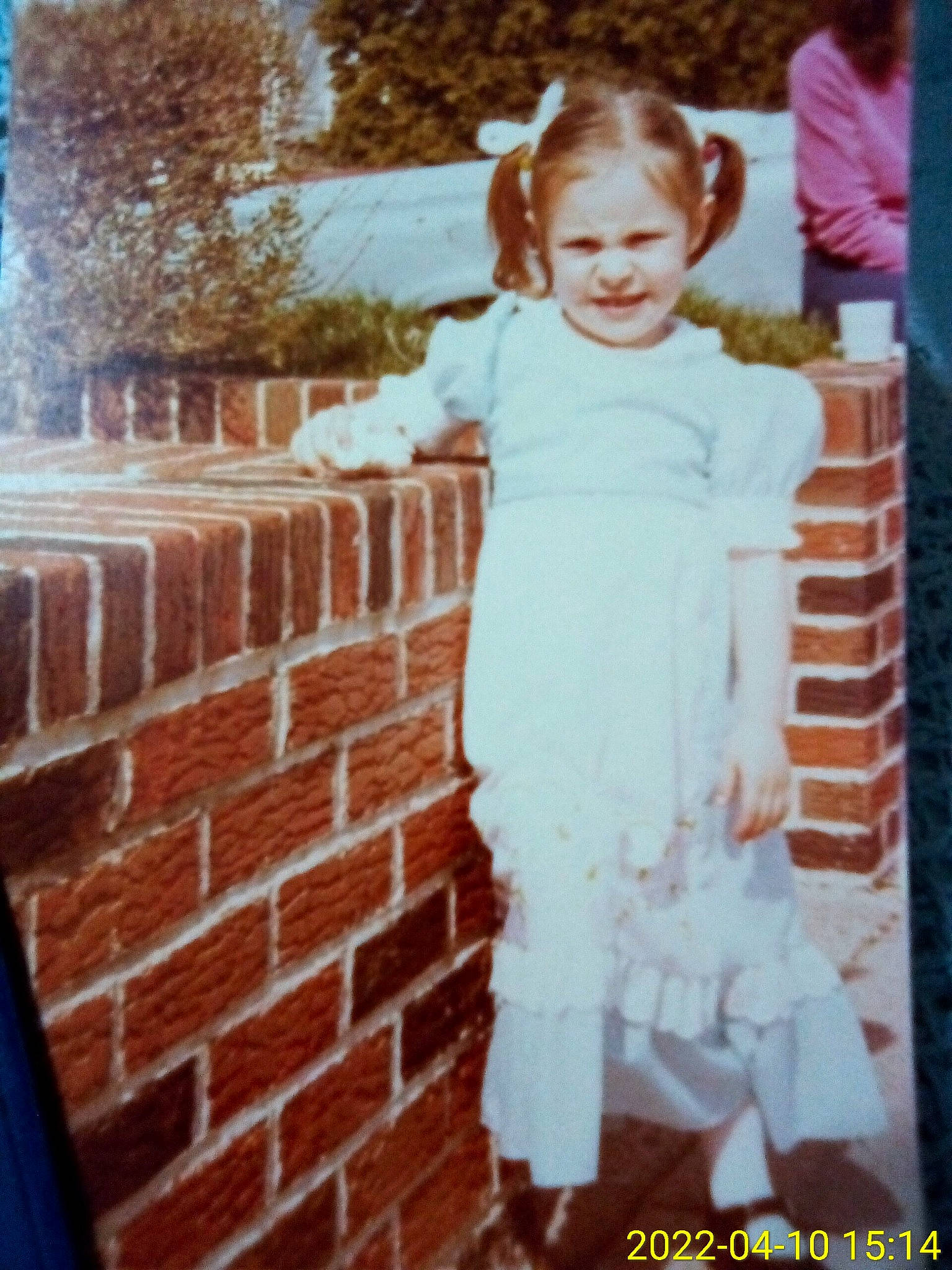 Lisa is registered to the contest to win money with this photo: brick, brickwork, ceremony, child, face, formal_wear, fun, fur, gown, happy, joy, pattern, people_in_nature, person, sitting, sleeve, smile, street_fashion, toddler, vintage_clothing