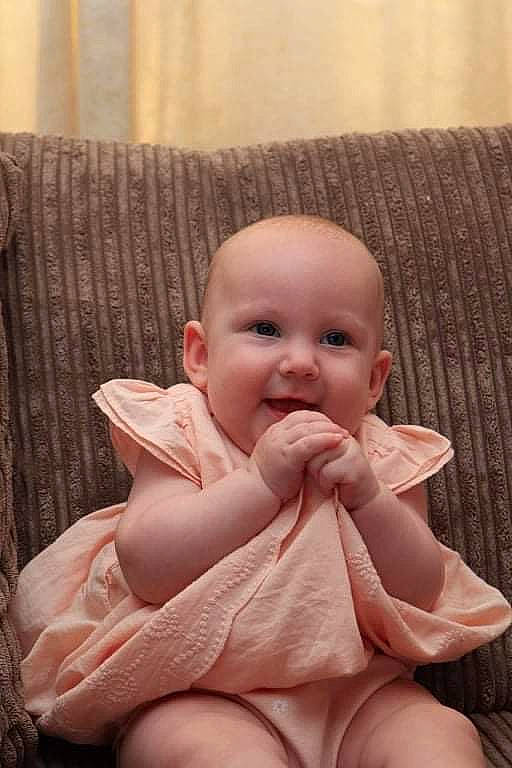 Poppy joined the competition — help win amazing prizes! baby, baby_toddler_clothing, cheek, comfort, eye, finger, flooring, gesture, happy, iris, lip, mouth, nail, nose, person, pink, skin, smile, stomach, thumb