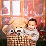 Noé a rejoint le concours — aidez-le/la à gagner de superbes lots ! child, toddler, baby, basket, teddy_bear, stuffed_animal, smile, portrait, cozy, indoor, holiday, christmas, window, lantern, plush, wood_floor, prop, clothing, sitting, adorable