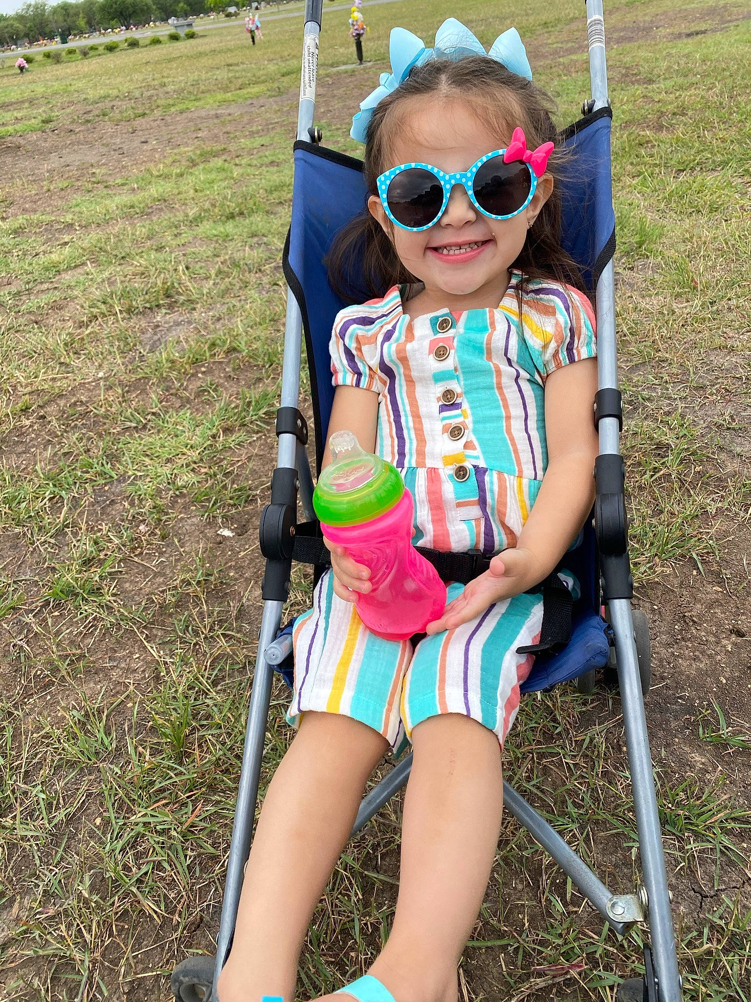 Serenity joined the competition — help win amazing prizes! baby_toddler_clothing, child, electric_blue, eyewear, fun, glasses, goggles, grass, happy, joy, leisure, outdoor_play_equipment, person, recreation, shorts, sitting, smile, sunglasses, swing, thigh