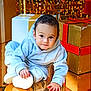toddler, child, baby, hoodie, gray_clothing, crawling, reflection, gift_box, holiday_lights, festive, indoors, floor, cozy, cute, young_child, smiling, face, hand, footwear, playful