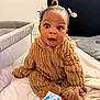 Giovanna joined the competition — help win amazing prizes! baby, child, fuzzy_outfit, bed, blanket, hair_ties, wide_eyes, surprised_expression, nursery, crib, headboard, baby_wipes, indoor, person, portrait, cute, seated, soft_texture, infant, clothing