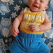 Matthias joined the competition — help win amazing prizes! baby, smiling, infant, yellow_tank_top, blue_shorts, owl_pattern, blanket, milestone_card, 3_months, happy, cute, child, lying_down, portrait, indoor, soft_texture, baby_clothes, hand, foot, face