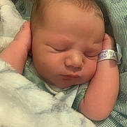 Tyson is registered to the contest to win money with this photo: newborn, baby, sleeping, blanket, hospital, id_bracelet, infant, closeup, soft, peaceful, face, skin, hands, resting, cute, child, portrait, indoors, cozy, young