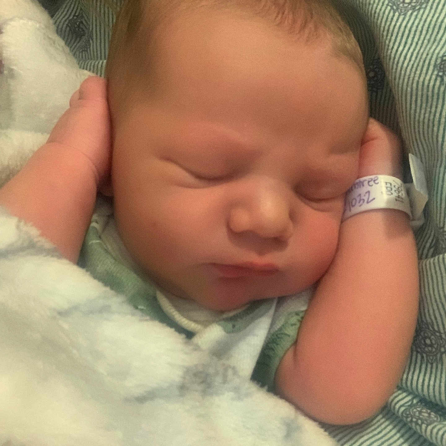 Tyson is registered to the contest to win money with this photo: newborn, baby, sleeping, blanket, hospital, id_bracelet, infant, closeup, soft, peaceful, face, skin, hands, resting, cute, child, portrait, indoors, cozy, young