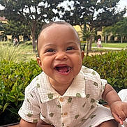 August joined the competition — help win amazing prizes! baby, smiling, outdoor, greenery, tree, wooden_surface, turtle_print, clothing, cute, happy, child, portrait, nature, grass, person, face, young_child, summer, casual, daylight