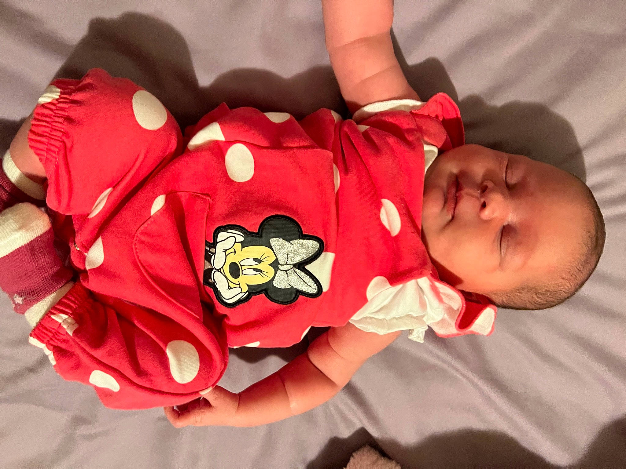 Aria Nevaeh is registered to the contest to win money with this photo: arm, baby, baby_sleeping, baby_toddler_clothing, child, comfort, facial_expression, finger, happy, headgear, human_body, mouth, orange, person, petal, pink, product, skin, sleeve, thigh