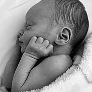 Camden is registered to the contest to win money with this photo: baby, newborn, sleeping, black_and_white, blanket, infant, peaceful, cute, portrait, soft_texture, skin, hand, face, head, ear, resting, closeup, cozy, tender, child