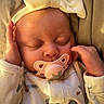 Lailynn joined the competition — help win amazing prizes! animal_print, baby, bow, child, closed_eyes, cozy, cute, face, hands, headband, indoors, infant, newborn, pacifier, pajamas, peaceful, portrait, resting, sleeping, soft_lighting