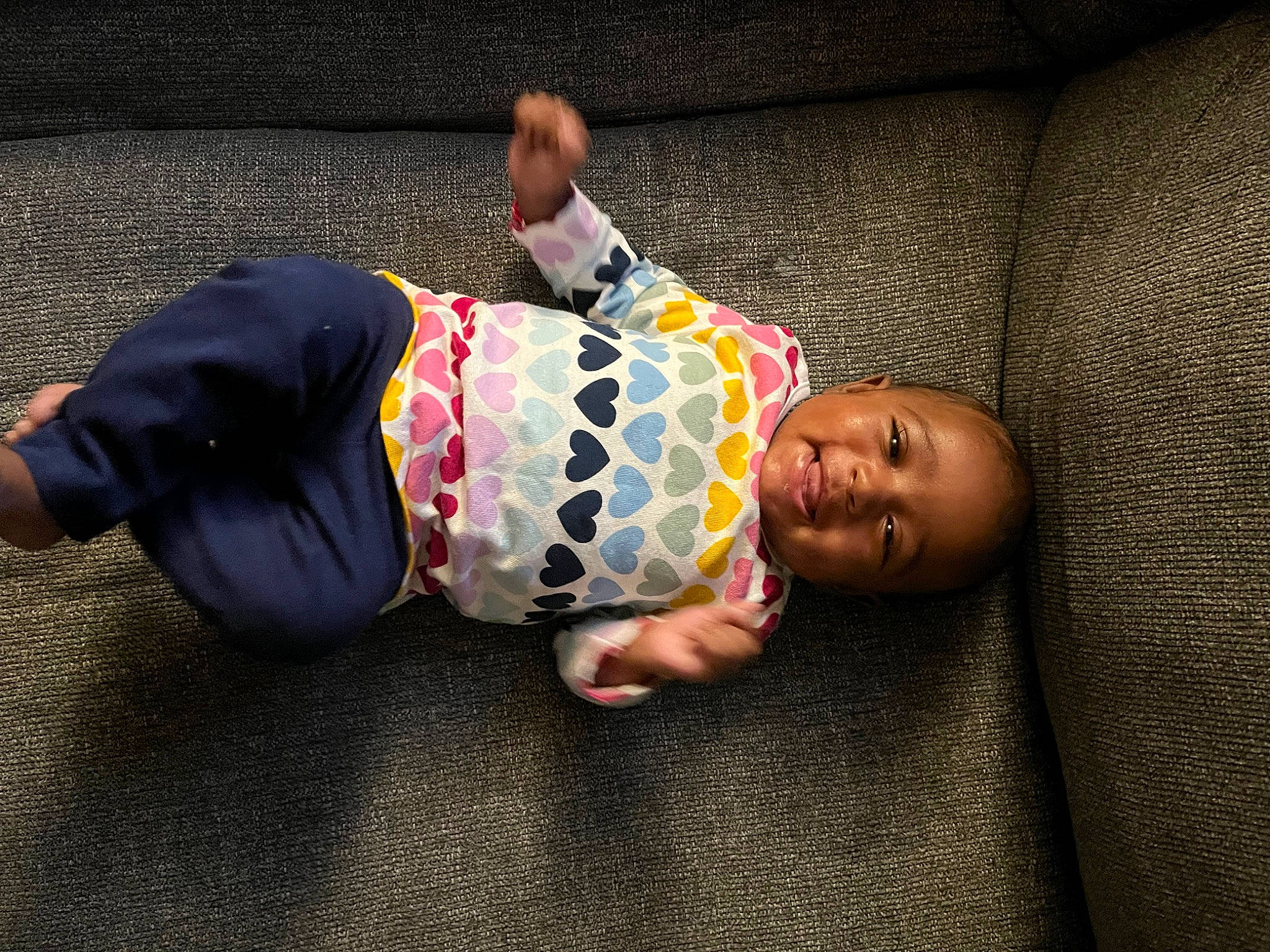 Zuri is registered to the contest to win money with this photo: baby, baby_products, baby_toddler_clothing, child, comfort, crawling, floor, flooring, fun, happy, person, room, sitting, sleep, sleeve, toddler, wood
