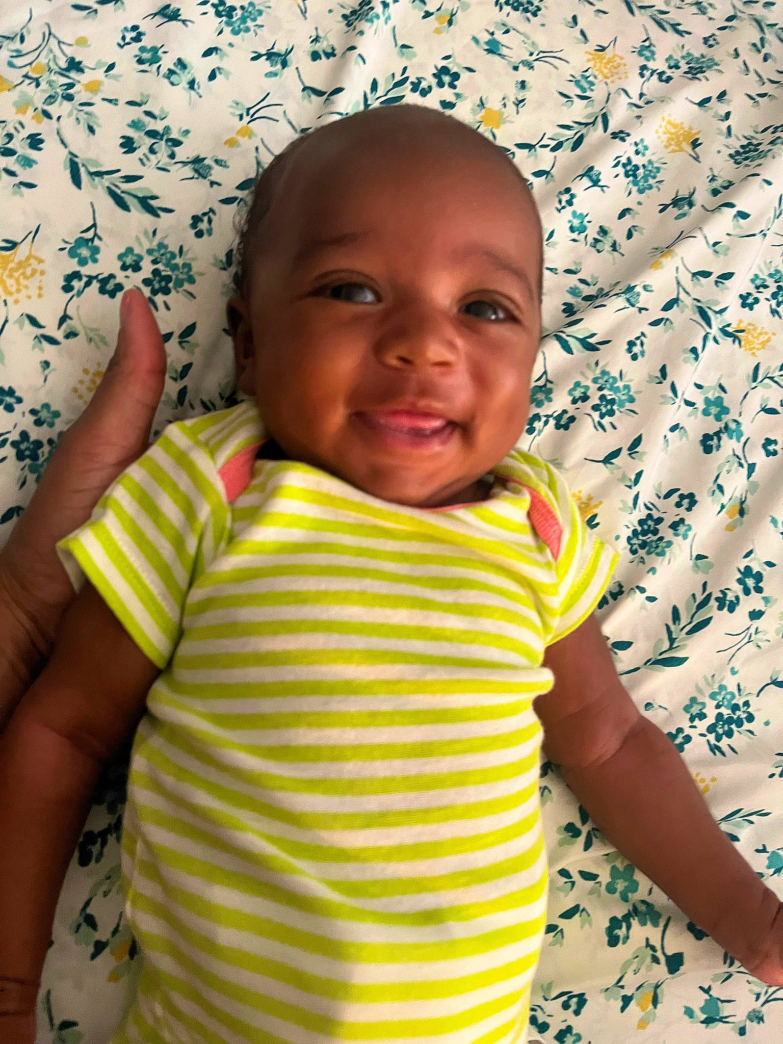 Zuri is registered to the contest to win money with this photo: azure, baby, baby_toddler_clothing, cheek, chin, eye, facial_expression, finger, hairstyle, happy, head, human, iris, mouth, nose, person, product, skin, sleeve, smile