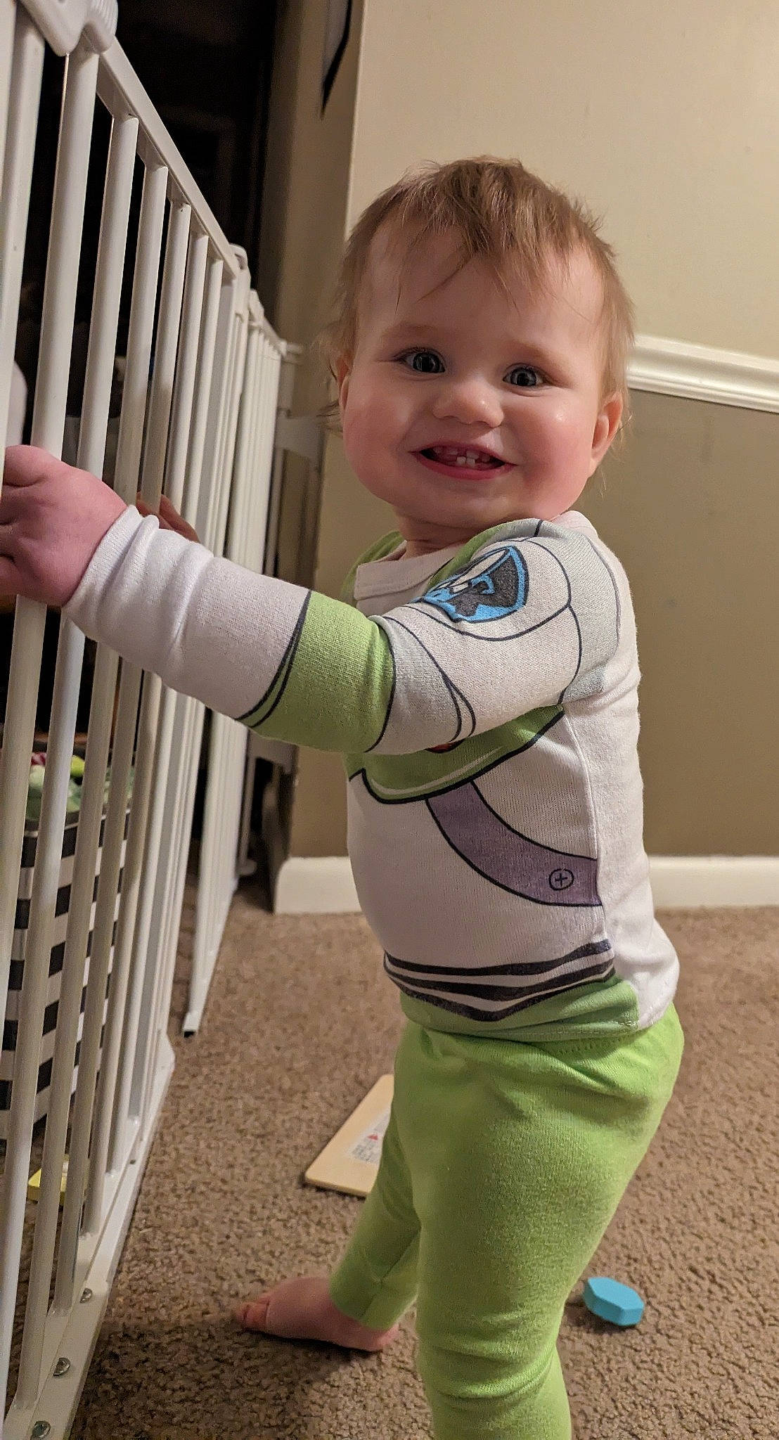 Alexander is registered to the contest to win money with this photo: arm, baby, baby_safety, baby_toddler_clothing, child, electric_blue, face, fence, fun, happy, human_body, joint, joy, pattern, person, shoulder, sleeve, smile, t_shirt, thumb