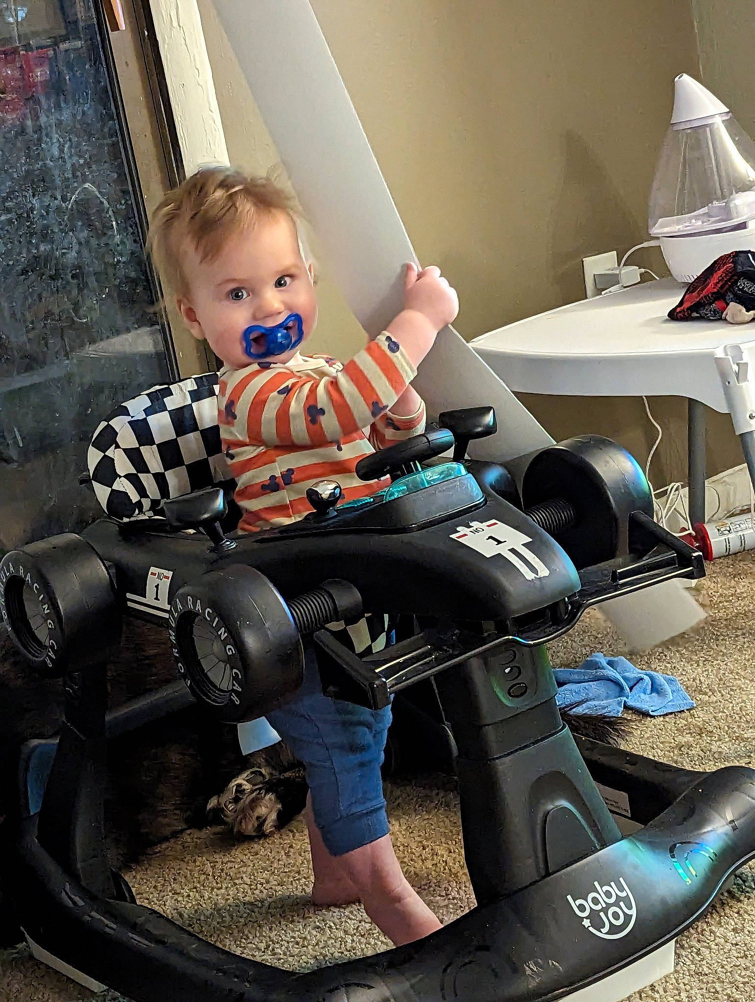 Alexander is registered to the contest to win money with this photo: automotive_tire, baby, baby_products, baby_toddler_clothing, bench, chair, child, comfort, electric_blue, fun, human_leg, knee, lap, leisure, luggage_and_bags, person, shorts, sitting, thigh, toddler