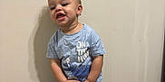 Mase joined the competition — help win amazing prizes! toddler, child, boy, curly_hair, standing, blue_tshirt, jeans, socks, carpet, wall, happy, expression, indoor, person, clothing, smiling, feet, young_child, casual, portrait