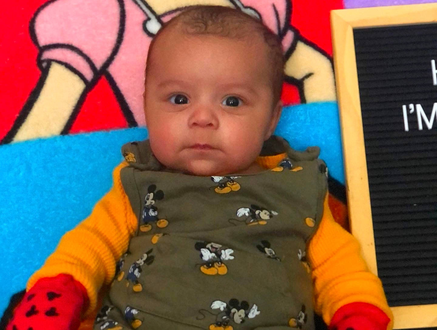 Luciano joined the competition — help win amazing prizes! baby, baby_toddler_clothing, cheek, eye, face, facial_expression, finger, fun, happy, head, human_body, iris, jacket, mouth, nose, orange, person, product, skin, sleeve
