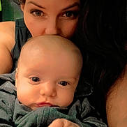 Castiel is registered to the contest to win money with this photo: baby, infant, adult, mother, parent, portrait, close_up, cuddle, bonding, hands, eyes, face, hair, skin, sweater, indoor, love, snuggle, selfie, expression