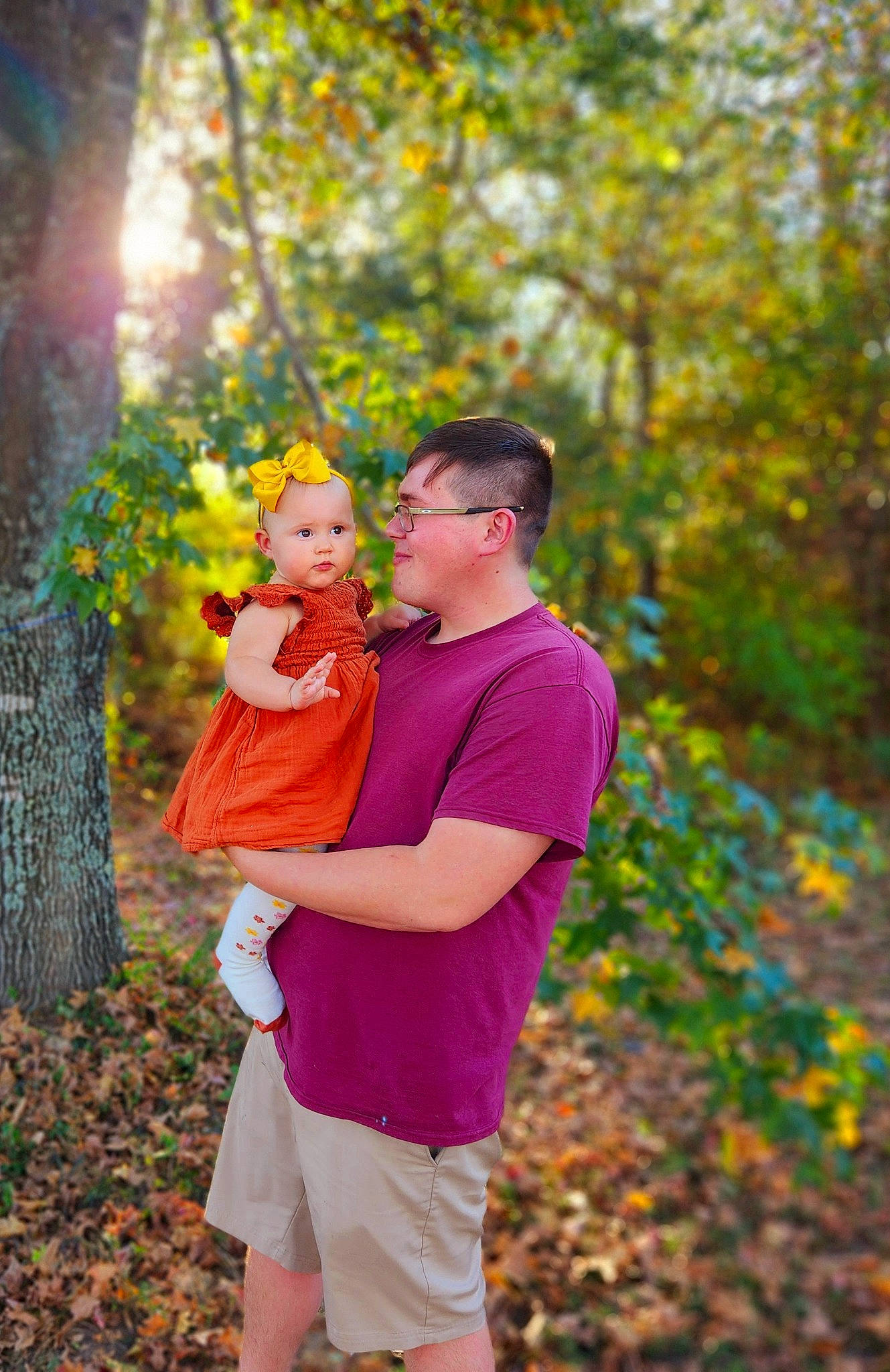 Rexleigh Elora-grace Dover is registered to the contest to win money with this photo: baby, deciduous, event, forest, fun, gesture, grass, happy, leaf, leisure, magenta, orange, people_in_nature, person, plant, recreation, shorts, t_shirt, toddler, tree