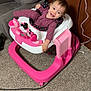 Lilian joined the competition — help win amazing prizes! toddler, baby, walker, toy, pink, purple_clothing, carpet, indoor, smile, happy, child, furniture, couch, wall, plug, cord, floor, person, head, face