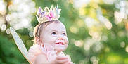 Lilian is registered to the contest to win money with this photo: toddler, child, fairy_wings, crown, butterflies, pink_dress, smile, blue_eyes, outdoor, nature, greenery, sunlight, portrait, happy, costume, fantasy, cute, baby, headband, magic