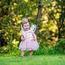 Lilian joined the competition — help win amazing prizes! toddler, child, fairy_costume, pink_dress, crown, wings, grass, outdoor, nature, forest, greenery, barefoot, smiling, cute, portrait, sunlight, flower_decorations, young_child, costume, whimsical