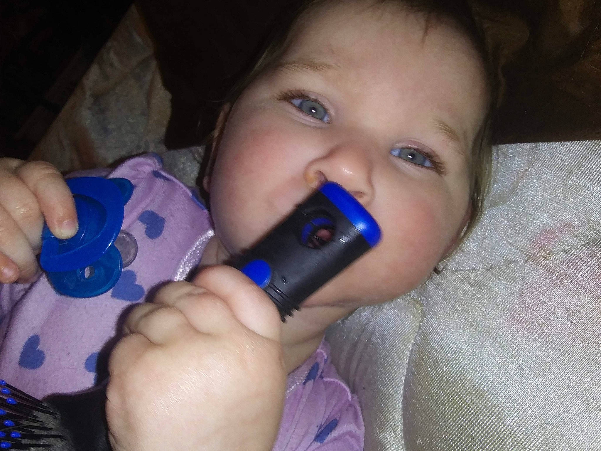 Delaney is registered to the contest to win money with this photo: baby, baby_products, blue, cheek, child, eye, eyebrow, face, finger, hand, head, iris, lip, material_property, mouth, nail, nose, person, product, skin