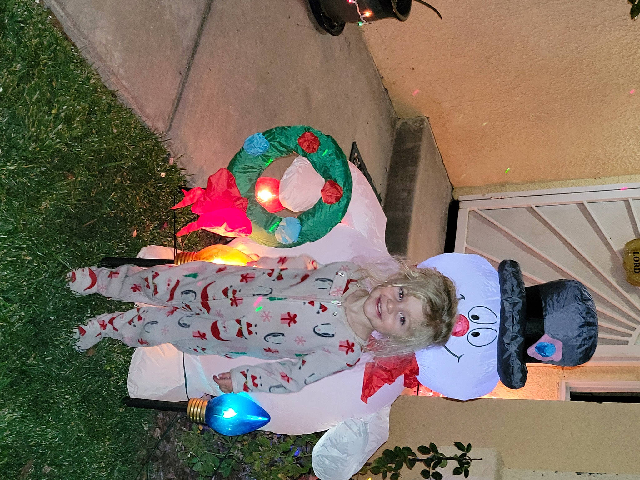 Rylee is registered to the contest to win money with this photo: baby_toddler_clothing, carmine, child, christmas, christmas_eve, event, fictional_character, fun, grass, happy, holiday, joy, lap, party_supply, person, play, toddler