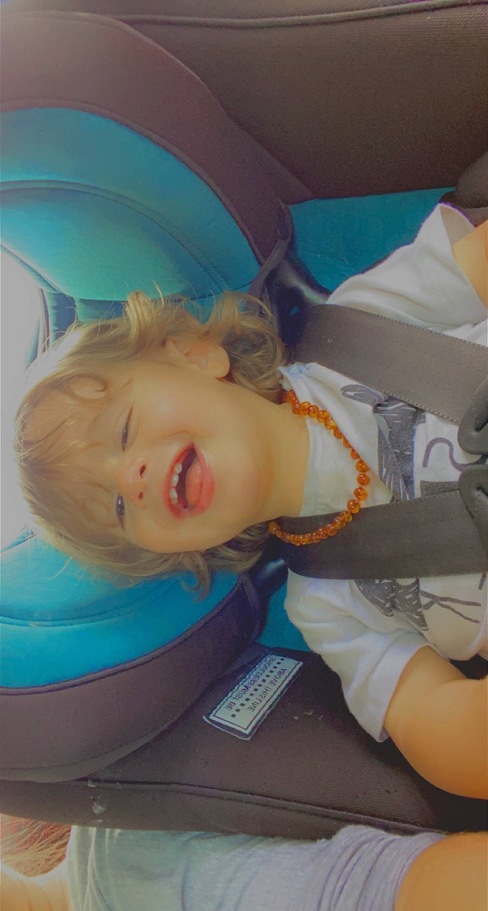 Ezra joined the competition — help win amazing prizes! baby, baby_products, baby_toddler_clothing, blue, chair, cheek, child, comfort, electric_blue, fun, hairstyle, leisure, mouth, person, room, sitting, skin, smile, toddler, vacation