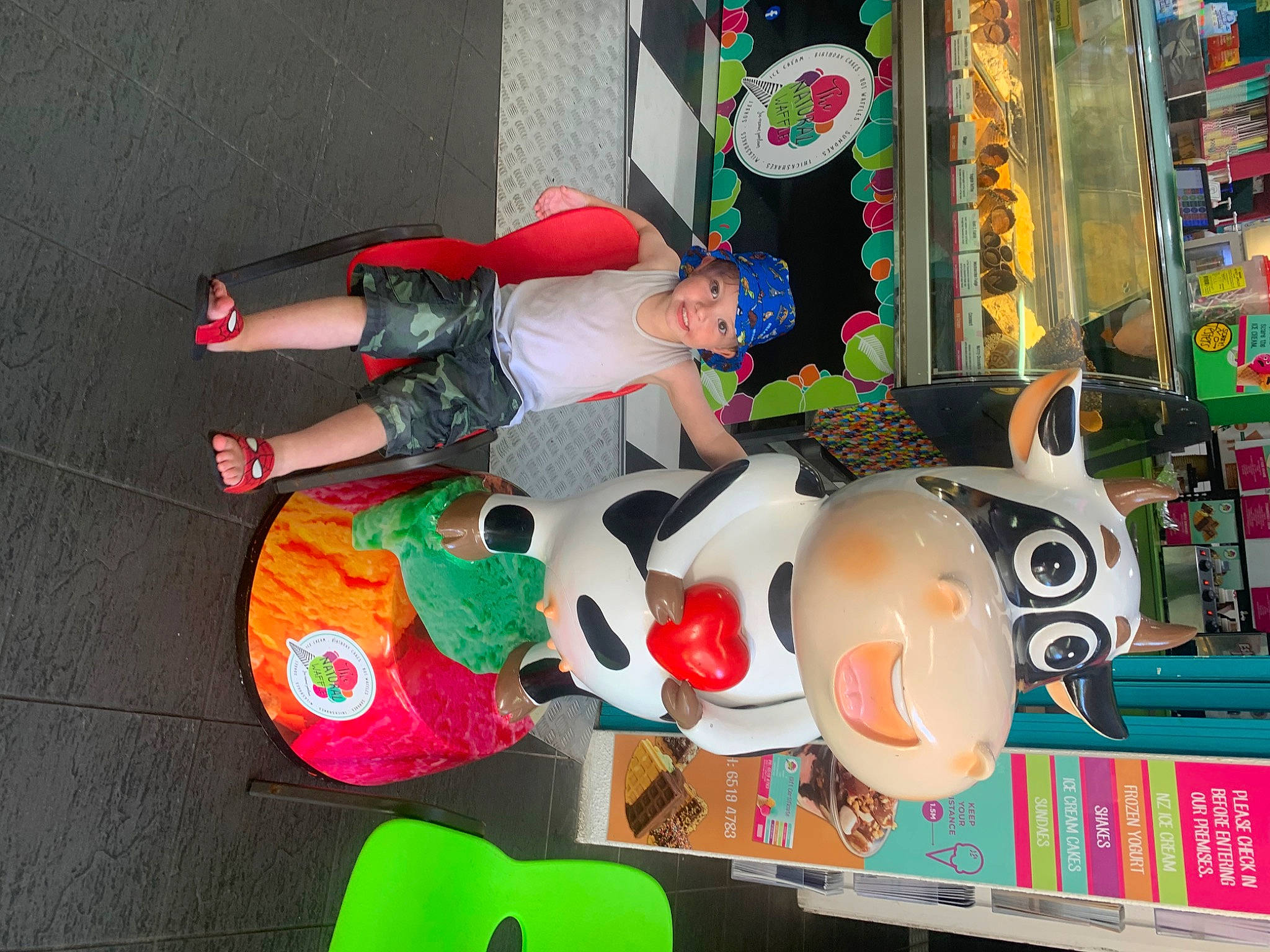 Kaylen joined the competition — help win amazing prizes! carmine, costume, event, fictional_character, fun, hat, headwear, holiday, joy, person, plastic, room, smile, toy, window