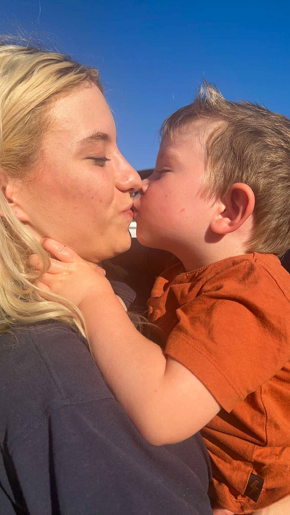 Kaylen is registered to the contest to win money with this photo: baby, cheek, child, event, flash_photography, fun, gesture, grass, happy, iris, kiss, lip, love, neck, nose, people_in_nature, person, romance, sky, sunlight