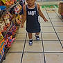Milani is registered to the contest to win money with this photo: toddler, child, girl, store, convenience_store, snacks, chips, dress, sneakers, pigtails, tile_floor, aisle, curious, walking, indoor, person, young_child, clothing, retail, shopping