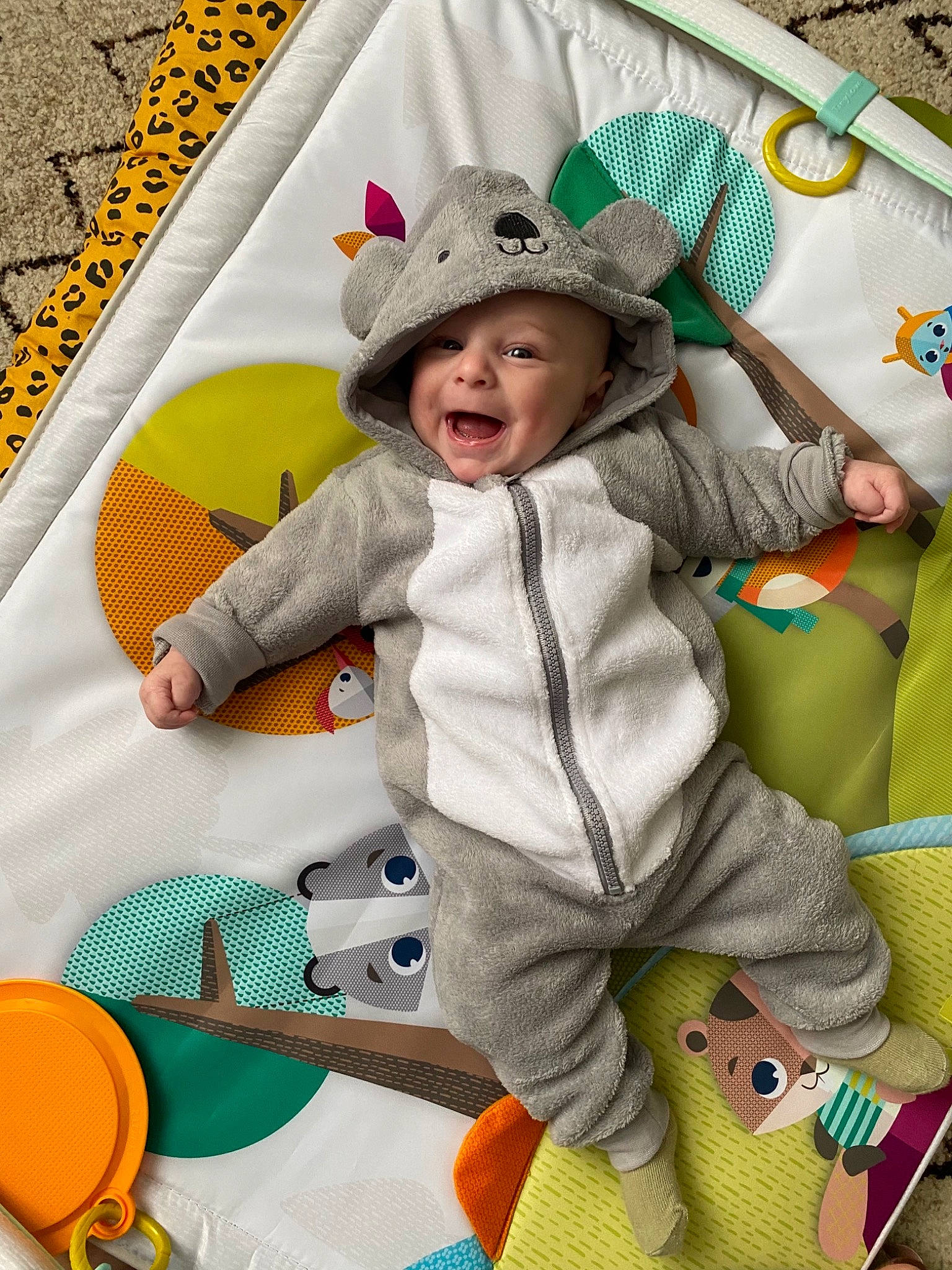 Ange participe au concours pour gagner de l'argent avec cette photo : baby_playing_with_toys, baby_toddler_clothing, clothing, face, facial_expression, fun, green, happy, hat, head, headwear, leisure, outerwear, person, product, purple, smile, sun_hat, textile, toddler