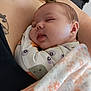 baby, sleeping, blanket, onesie, infant, closeup, face, peaceful, cozy, person, tattoo, skin, resting, cute, soft, comfort, child, arm, adult, indoor