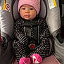 baby, beanie, bonnet, cap, car, car_interior, carseat, clothing, cushion, face, furniture, hat, head, person, photography, portrait, skin, tattoo, transportation, vehicle