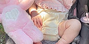 Arbour Grace joined the competition — help win amazing prizes! baby, sleeping, car_seat, headband, bow, plush_toy, pink, blanket, outdoor, grass, foot, hand, infant, soft_toy, clothing, person, child, cute, resting, sunlight