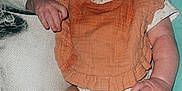 Arbour Grace is registered to the contest to win money with this photo: baby, bib, blanket, child, clothing, cushion, cute, drool, face, hand, indoor, infant, legs, onesie, person, plush, portrait, red_eye, sitting, skin