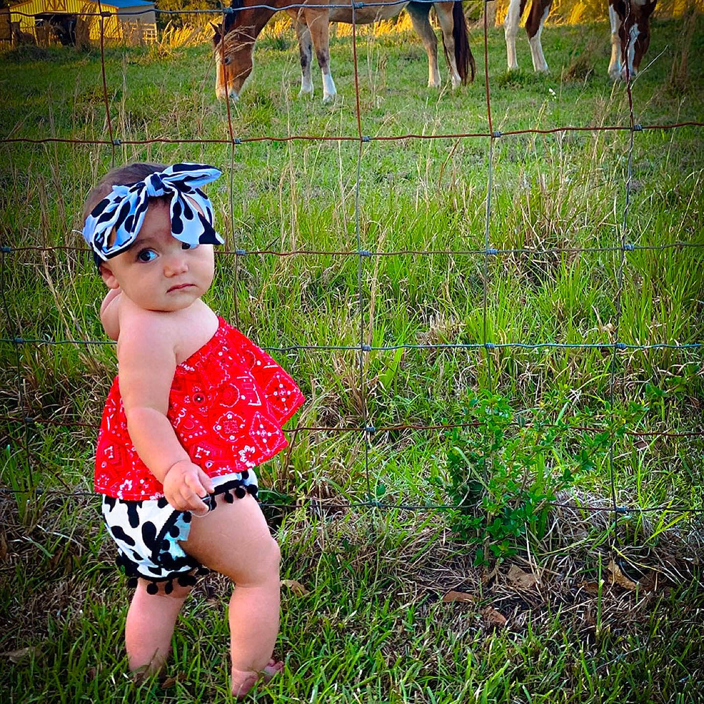 Princess is registered to the contest to win money with this photo: baby_toddler_clothing, child, eyewear, fawn, goggles, grass, grass_family, grassland, happy, headgear, headwear, landscape, mammal, meadow, pattern, people_in_nature, person, personal_protective_equipment, plant, sunglasses