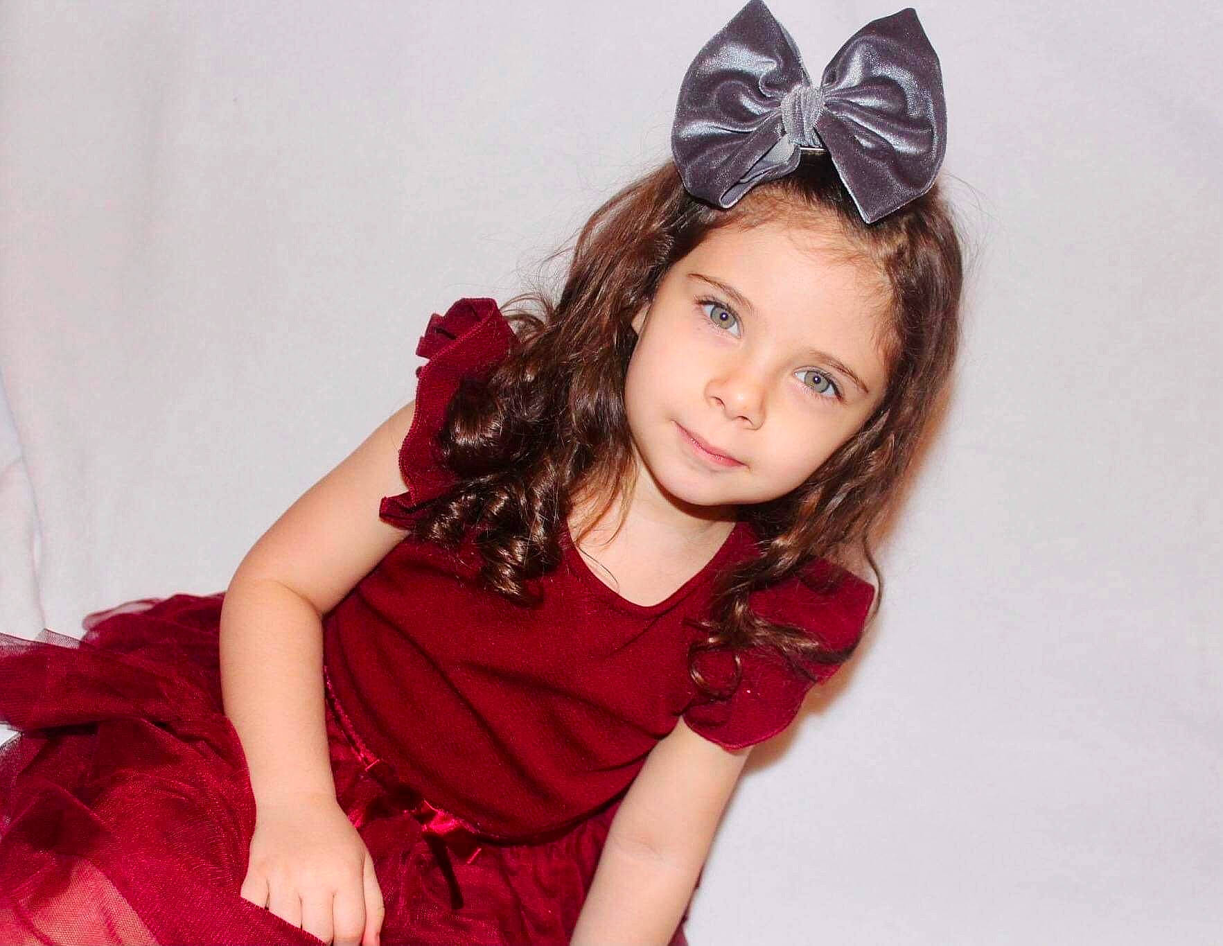 Paisleigh is registered to the contest to win money with this photo: black_hair, brown_hair, day_dress, dress, eyelash, fashion_accessory, fashion_design, flash_photography, happy, headpiece, human_leg, jewellery, lip, long_hair, magenta, neck, person, pink, sleeve, smile