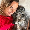 animal, closeup, couch, cozy, dog, face, friendship, fur, hair, happy, indoor, love, pet, portrait, red_shirt, relaxation, skin, smile, snuggle, woman