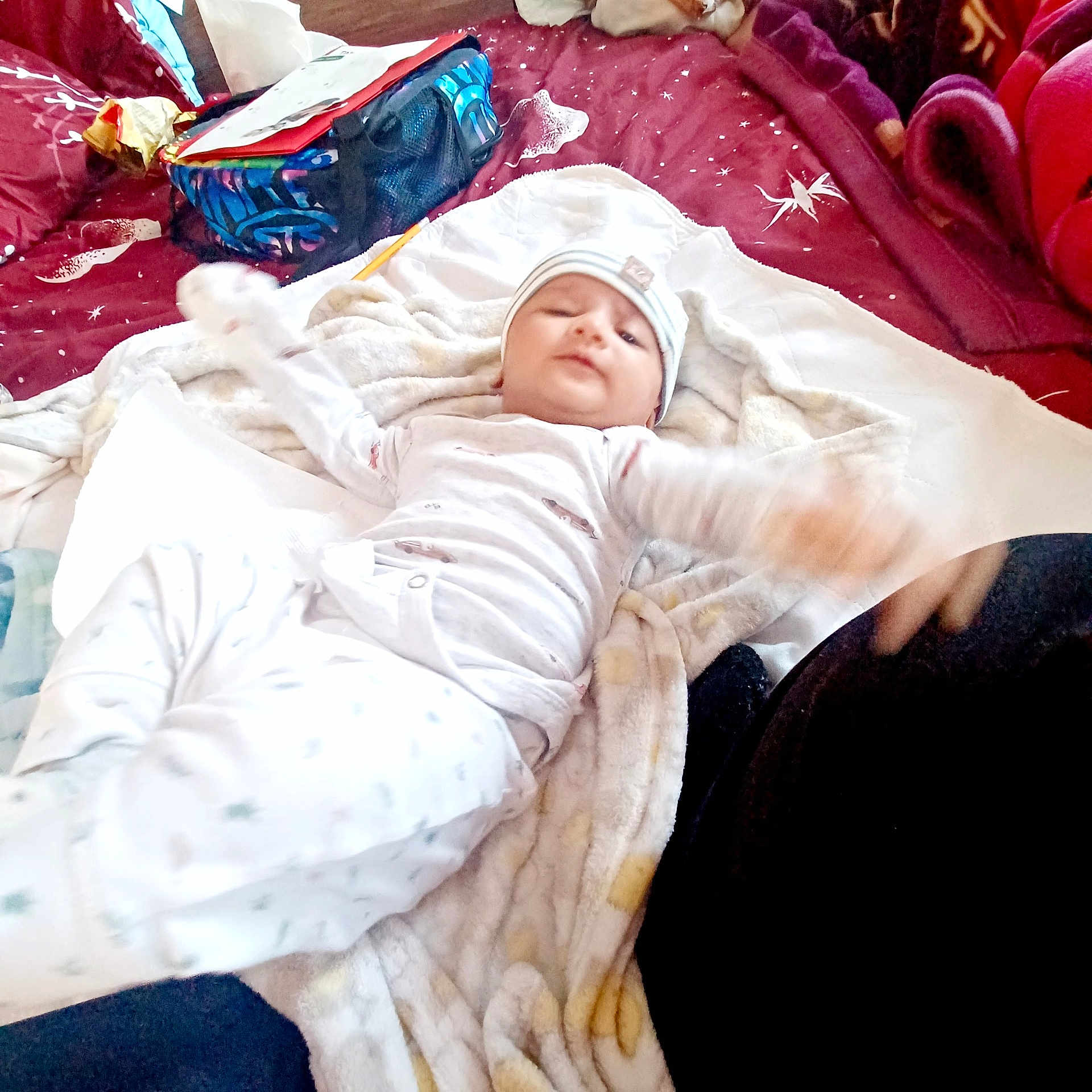 Kewin Shira joined the competition — help win amazing prizes! baby, bed, bedding, bedroom, blanket, child, colorful, cozy, face, hat, indoor, infant, lying_down, motion_blur, pajamas, pillows, portrait, relaxed, smiling, striped_hat
