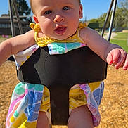 Hazel joined the competition — help win amazing prizes! baby, child, swing, playground, outdoor, sunny, blue_sky, colorful_clothing, tongue_out, happy, infant, playtime, summer, daylight, park, toddler, fun, smiling, chain, seat