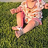 Hazel is registered to the contest to win money with this photo: baby, grass, outdoor, smiling, happy, child, pacifier, onesie, sunlight, person, sitting, toy, cute, nature, playful, infant, daylight, portrait, cheerful, greenery