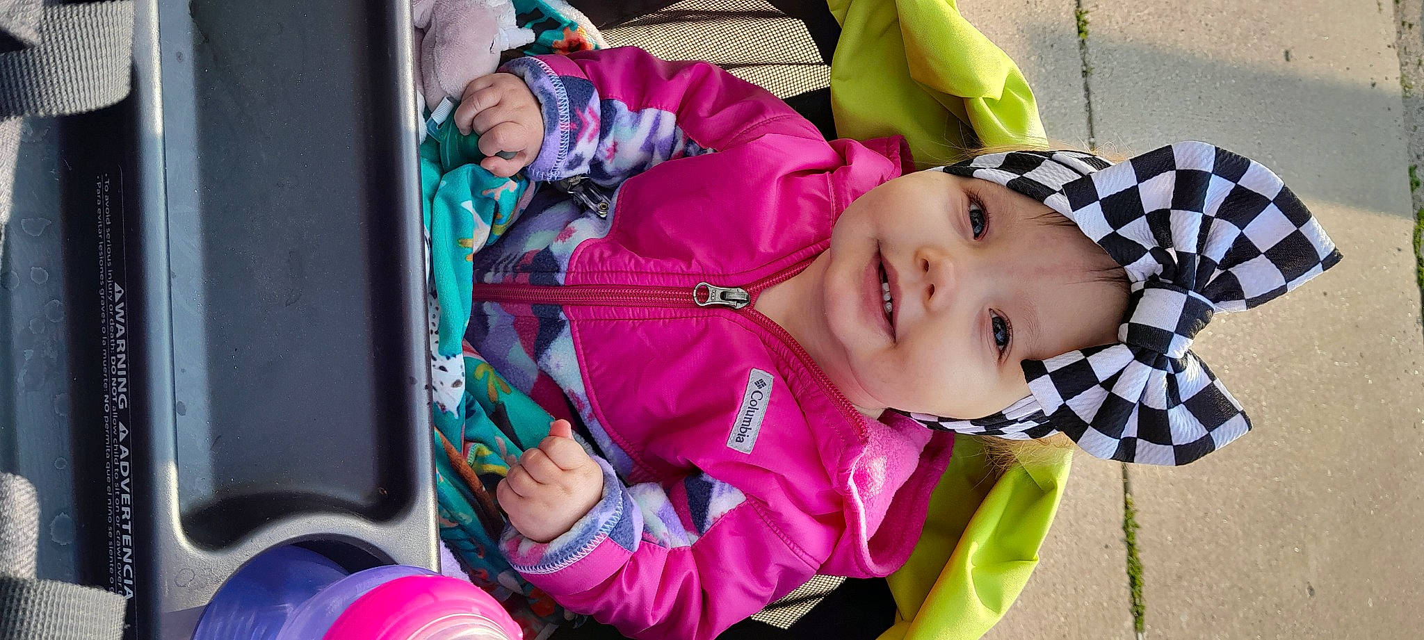 Kodie joined the competition — help win amazing prizes! baby, baby_carriage, baby_products, baby_toddler_clothing, child, fun, happy, headwear, joy, leisure, magenta, person, pink, public_space, purple, recreation, sitting, smile, suit, toddler