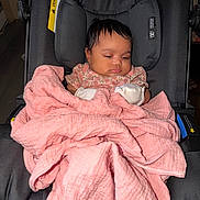 Diego joined the competition — help win amazing prizes! baby, blanket, black_stroller, child, cute, face, headrest, infant, indoors, mittens, peaceful, pink_blanket, resting, seated, soft_texture, toddler, wearing_clothes, young_child, wrapped, young_infant