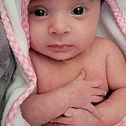 Skylar is registered to the contest to win money with this photo: baby, blanket, bodypart, bonnet, cap, clothing, face, hat, head, hood, hoodie, knitwear, newborn, person, photography, portrait, quilt, sweater, sweatshirt, towel