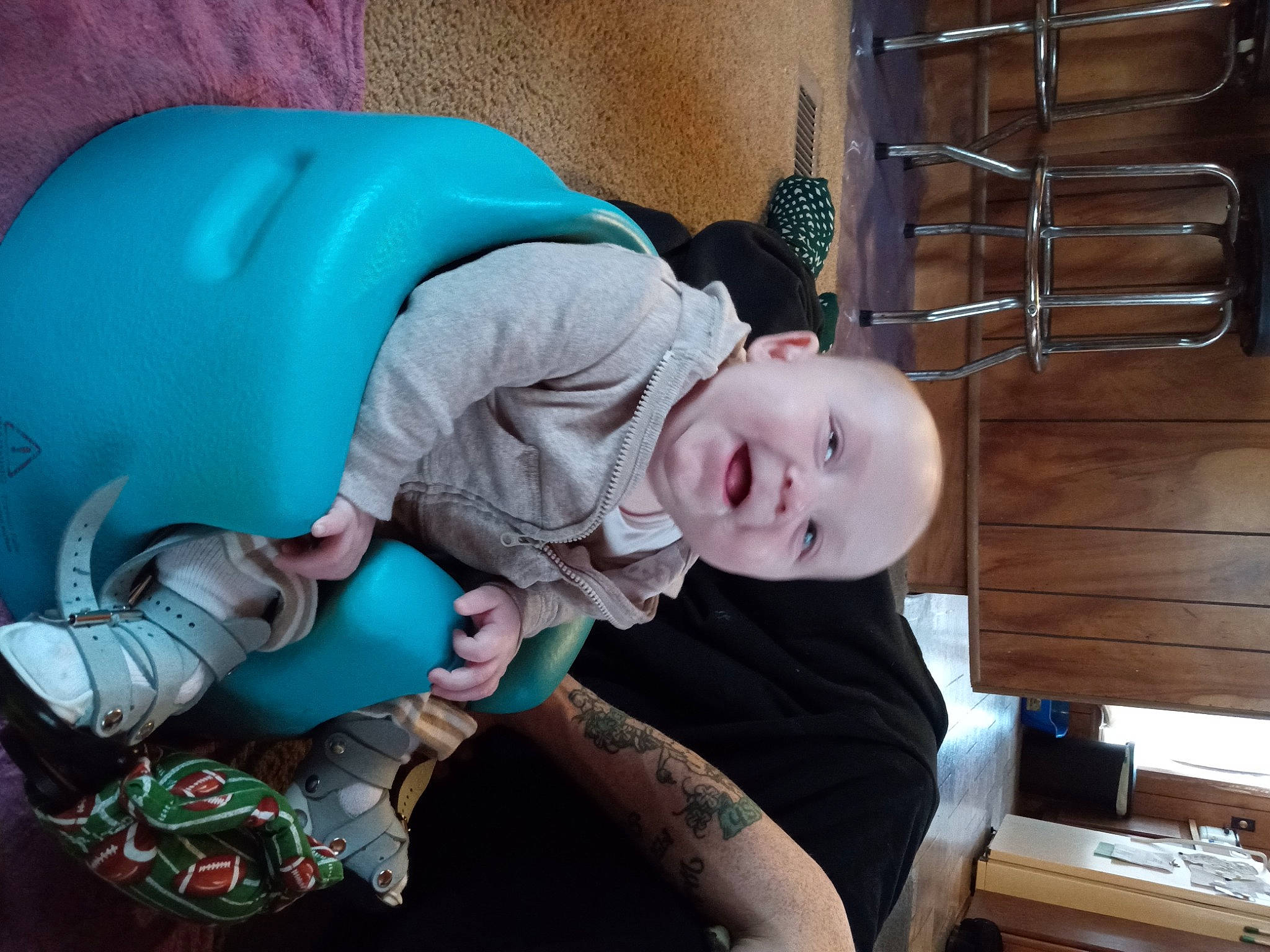 Patrick is registered to the contest to win money with this photo: baby, baby_products, baby_safety, baby_toddler_clothing, child, comfort, electric_blue, eye, fictional_character, fun, head, mammal, person, product, room, sitting, smile, toddler, tree, vertebrate